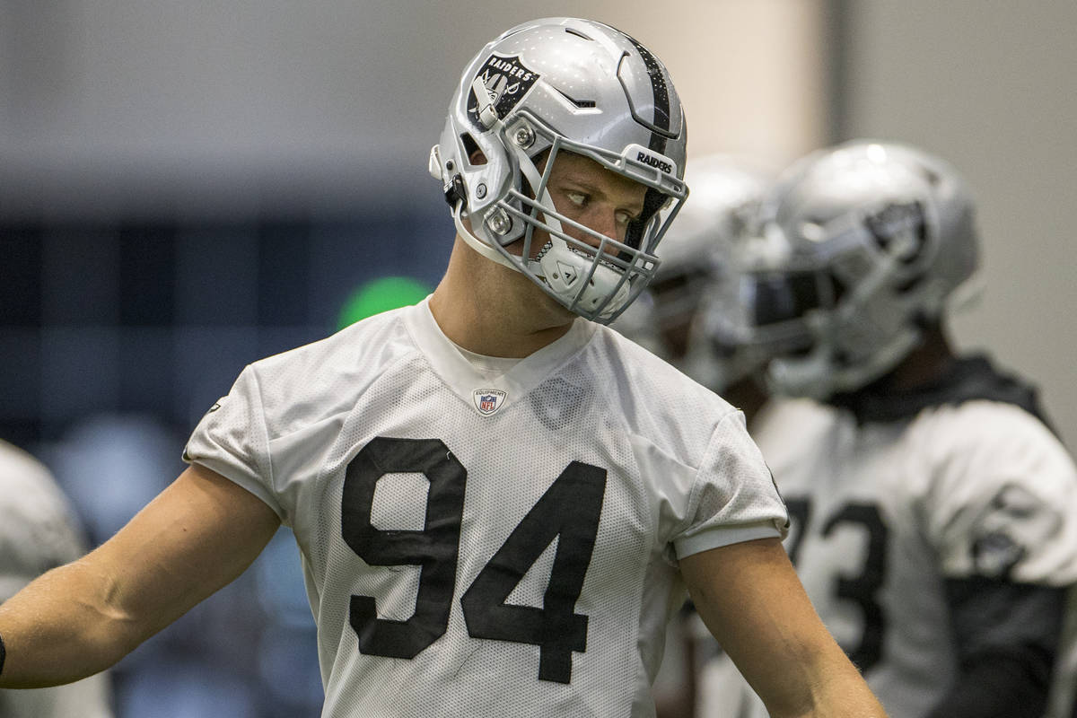 Las Vegas Raiders defensive end Carl Nassib (94) twists his body during warm ups at the Intermo ...