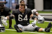 Las Vegas Raiders guard Richie Incognito (64) stretches with teammates during warm ups at the I ...
