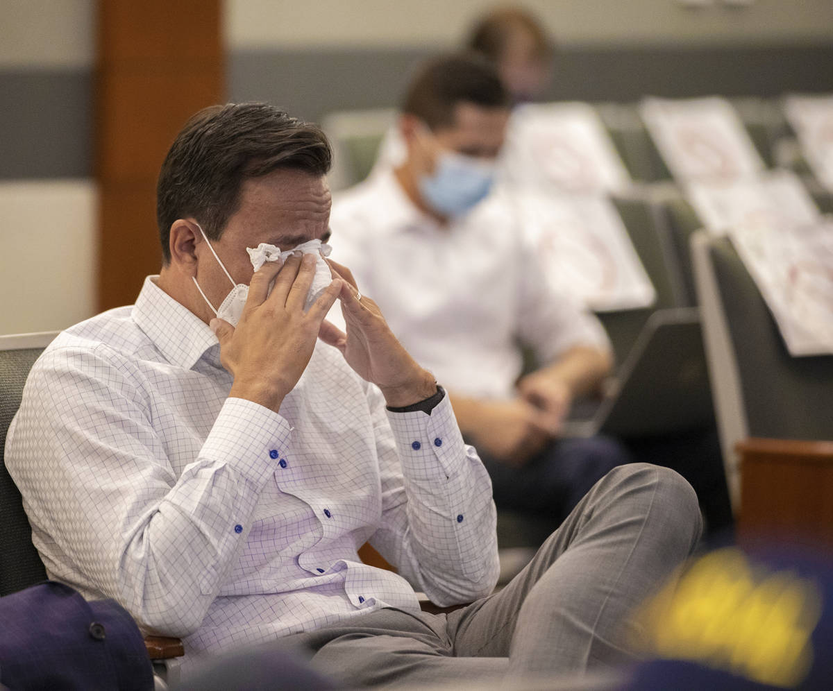 A friend of Melissa Newton, a mother of 3 killed in a DUI crash, wipes tears from his eyes duri ...