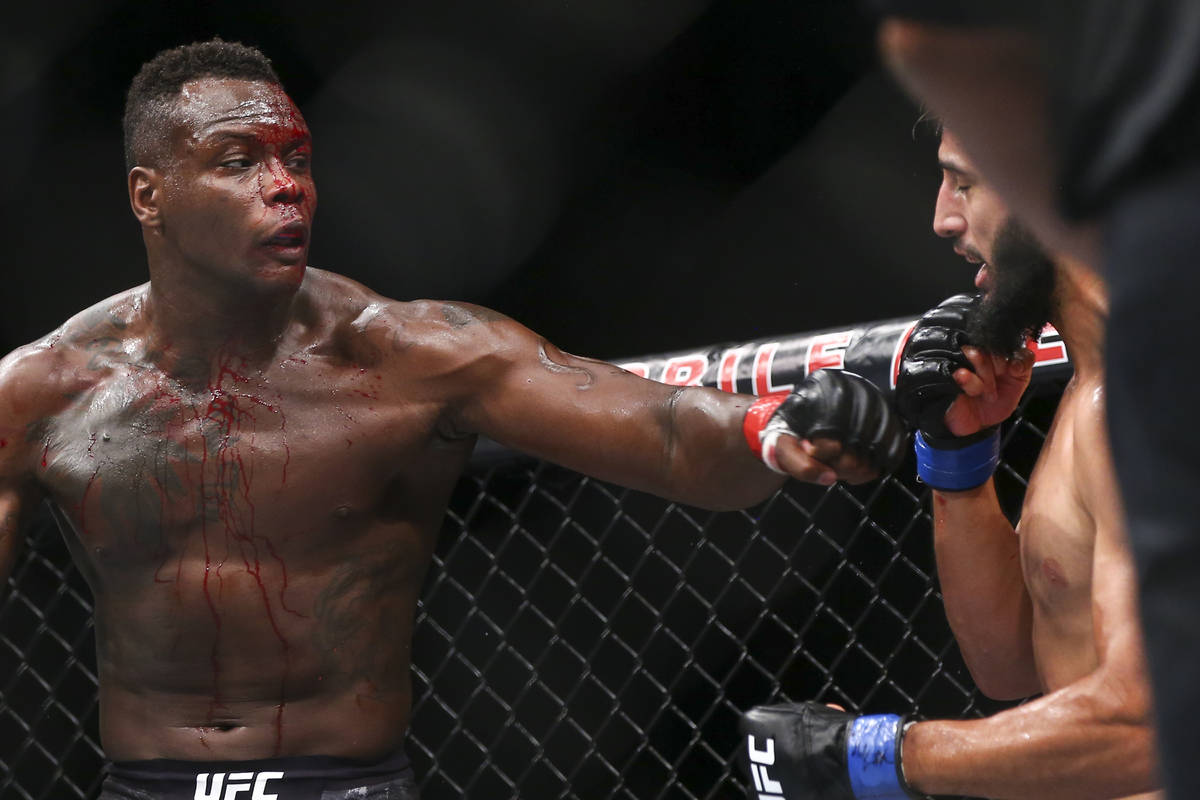 Ovince Saint Preux, left, fights Dominick Reyes during their light heavyweight bout at UFC 229 ...