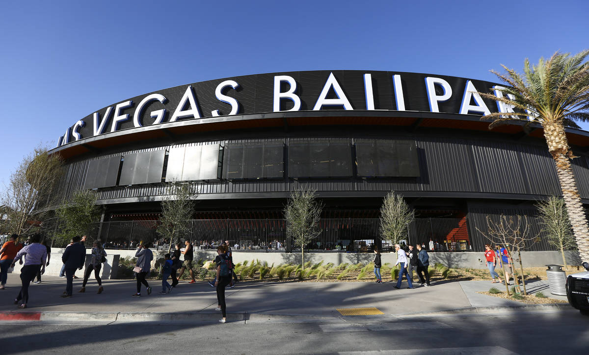 fans line up to enter the Las Vegas Ballpark for the Las Vegas Aviators' home opener in Downtow ...