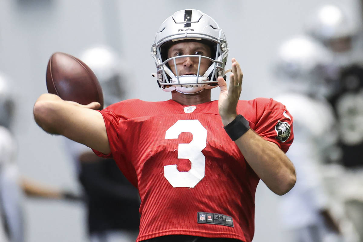 Las Vegas Raiders quarterback Nathan Peterman (3) prepares to throw a pass during an NFL traini ...