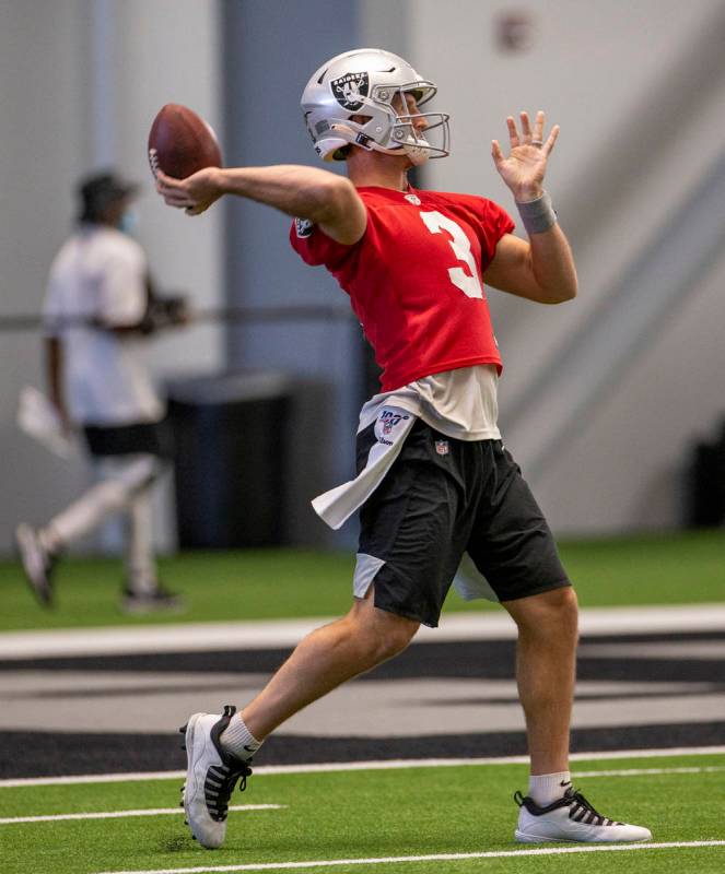 Las Vegas Raiders quarterback Nathan Peterman (3) winds up to pass during warm ups at the Inter ...