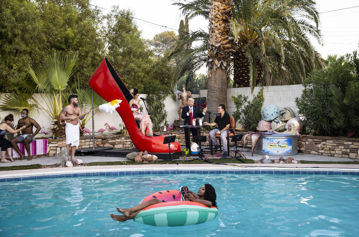 A look at the poolside scene, with floating author Khalilah Yasmin reading from her book "Matad ...
