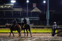 Trainer Bob Baffert watches as Kentucky Derby entry Thousand Words walks onto the track during ...