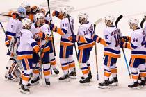 New York Islanders celebrate defeating the Philadelphia Flyers after third-period NHL Stanley C ...