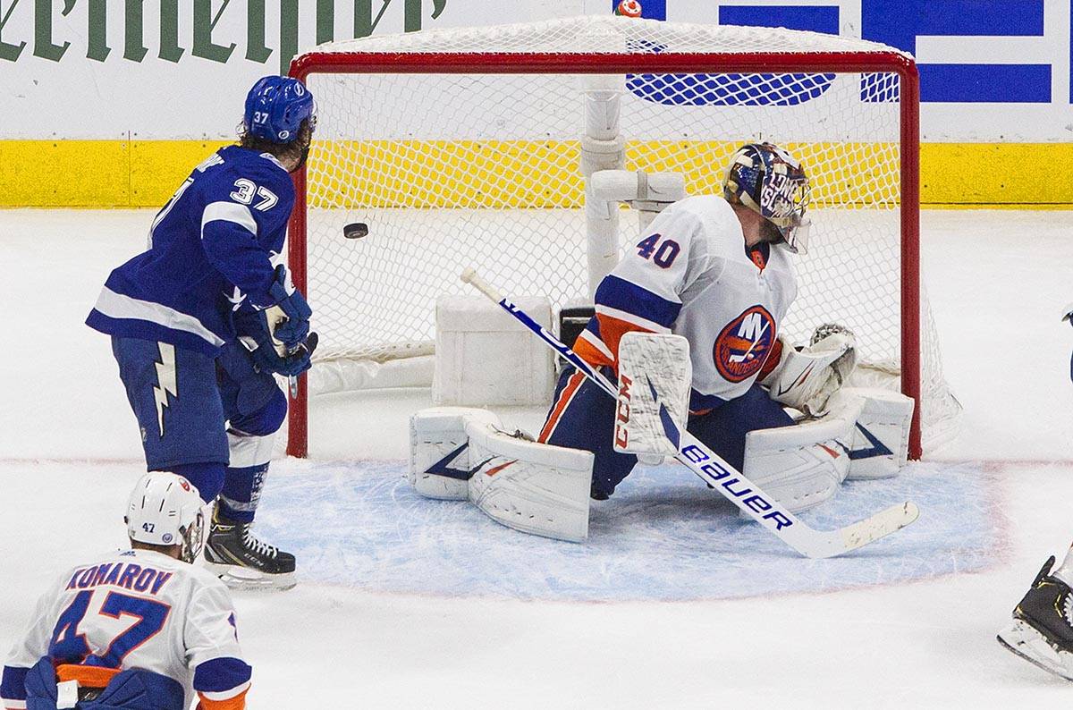 Tampa Bay Lightning's Yanni Gourde (37) watches the puck go in past New York Islanders goalie S ...