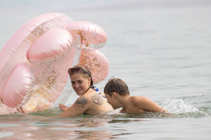 Stephanie Murphy plays with her son Aiden, 9, Both of Las Vegas, at Boulder beach in the Lake M ...