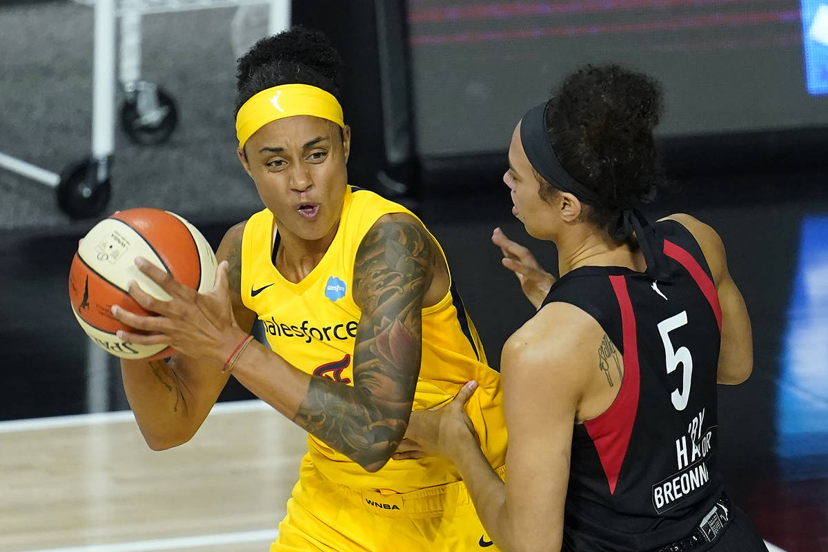 Indiana Fever forward Candice Dupree (4) works against Las Vegas Aces forward Dearica Hamby (5) ...