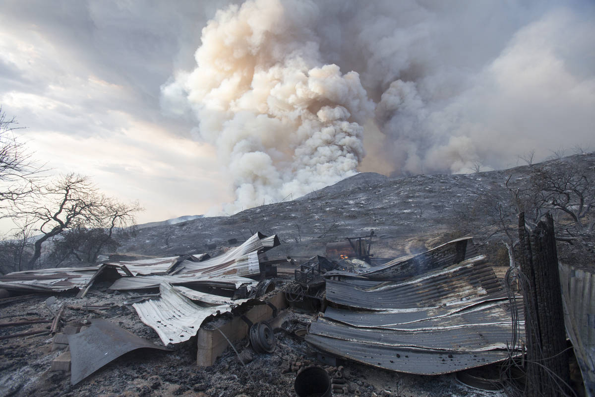 FILE - In this Saturday, Sept. 5, 2020, file photo, a burned structure is seen at a wildfire in ...