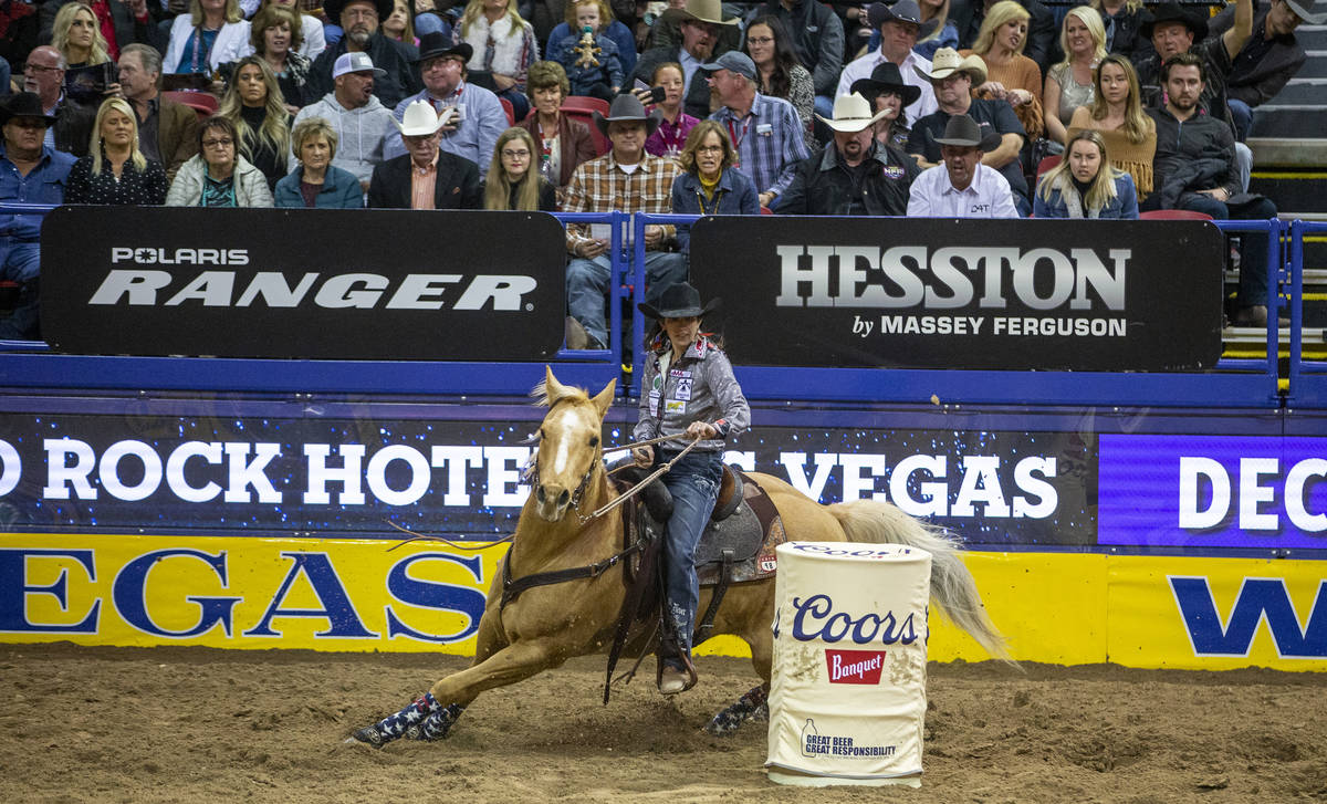 Jessica Routier of Buffalo, S.D., turns the corner in Barrel racing at the tenth go round of th ...