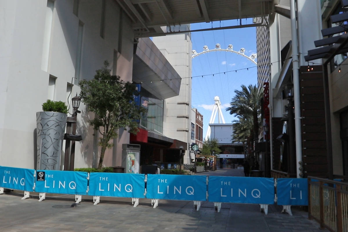 Barricades prevent people from entering the Linq Promenade remain on the Strip during the casin ...