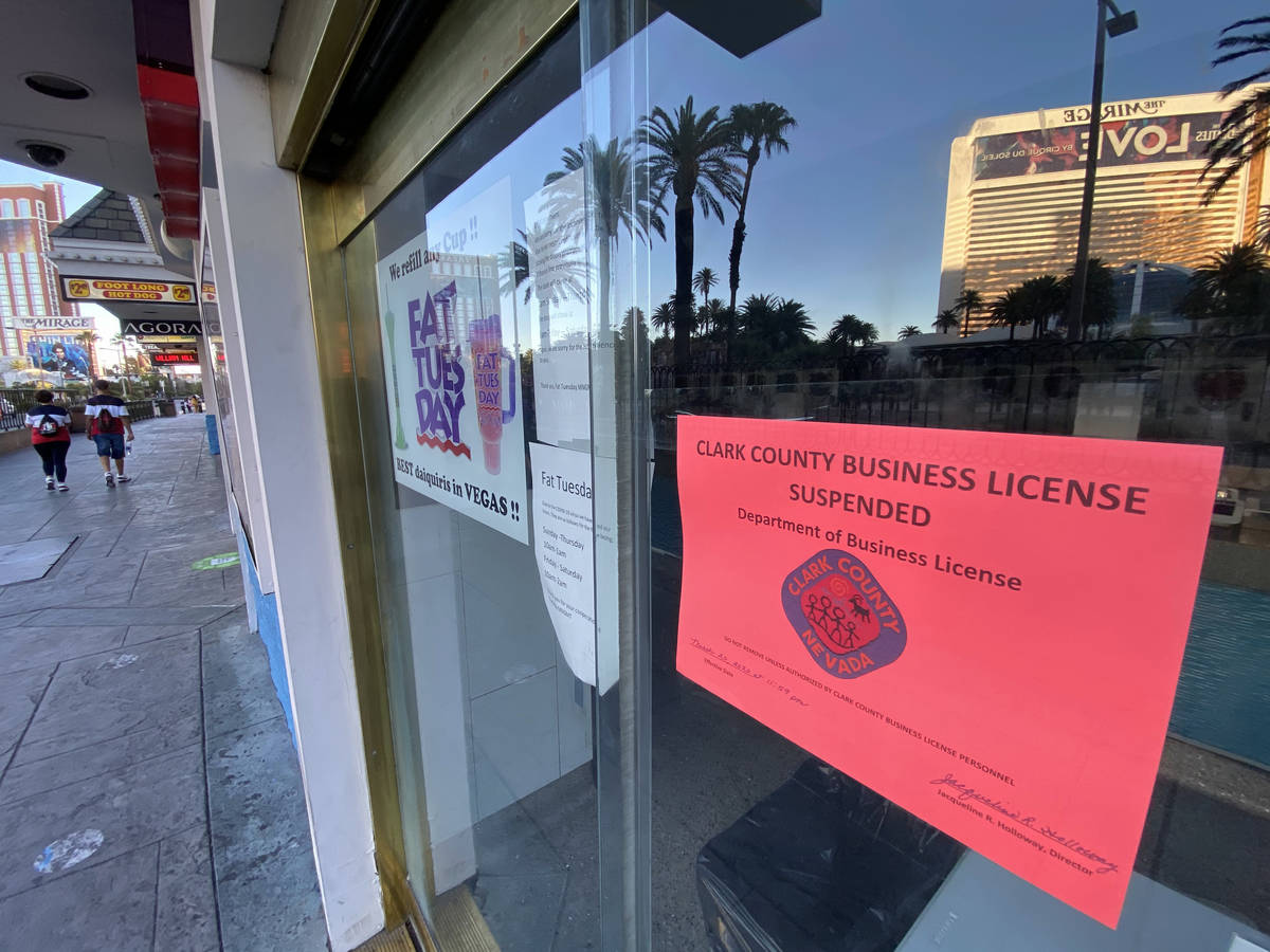 A Clark County sign states that the business license has been suspended at Fat Tuesday at Casin ...