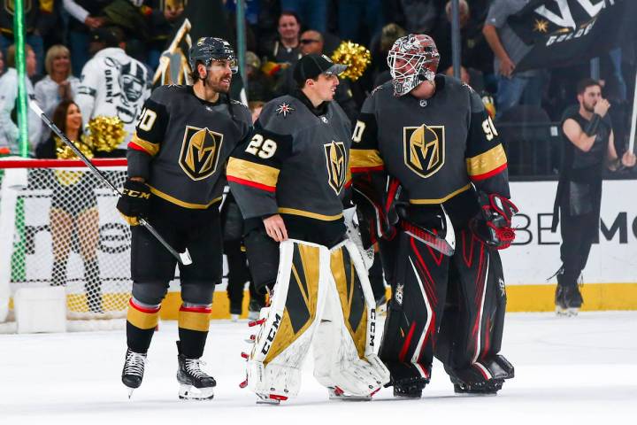 Golden Knights goaltenders Marc-Andre Fleury (29) and Robin Lehner (90) talk alongside Chandler ...