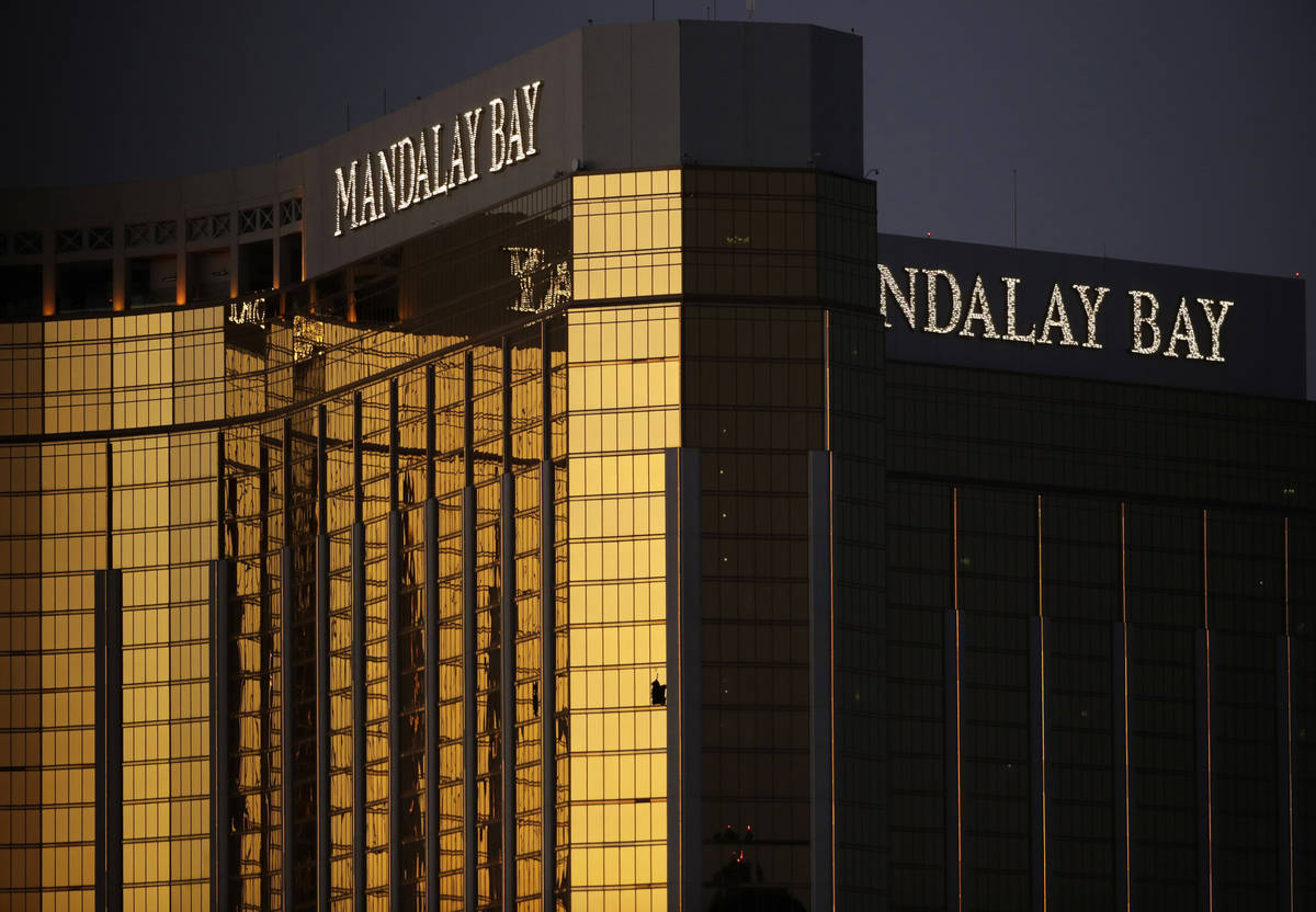 Windows are broken at the Mandalay Bay in Las Vegas following a mass shooting at a music festiv ...