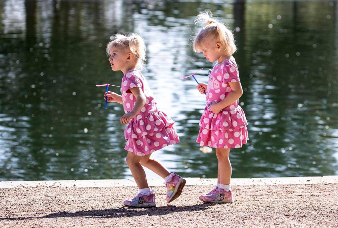 Eloise Agnew, 2, left, and her sister Penelope, 3, play at Sunset Park on Thursday, Sept. 10, 2 ...