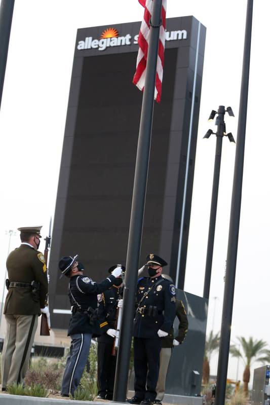 A multi-agency honor guard present the colors during a 9/11 ceremony at Allegiant Stadium in La ...