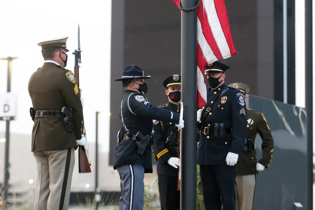 A multi-agency honor guard present the colors during a 9/11 ceremony at Allegiant Stadium in La ...