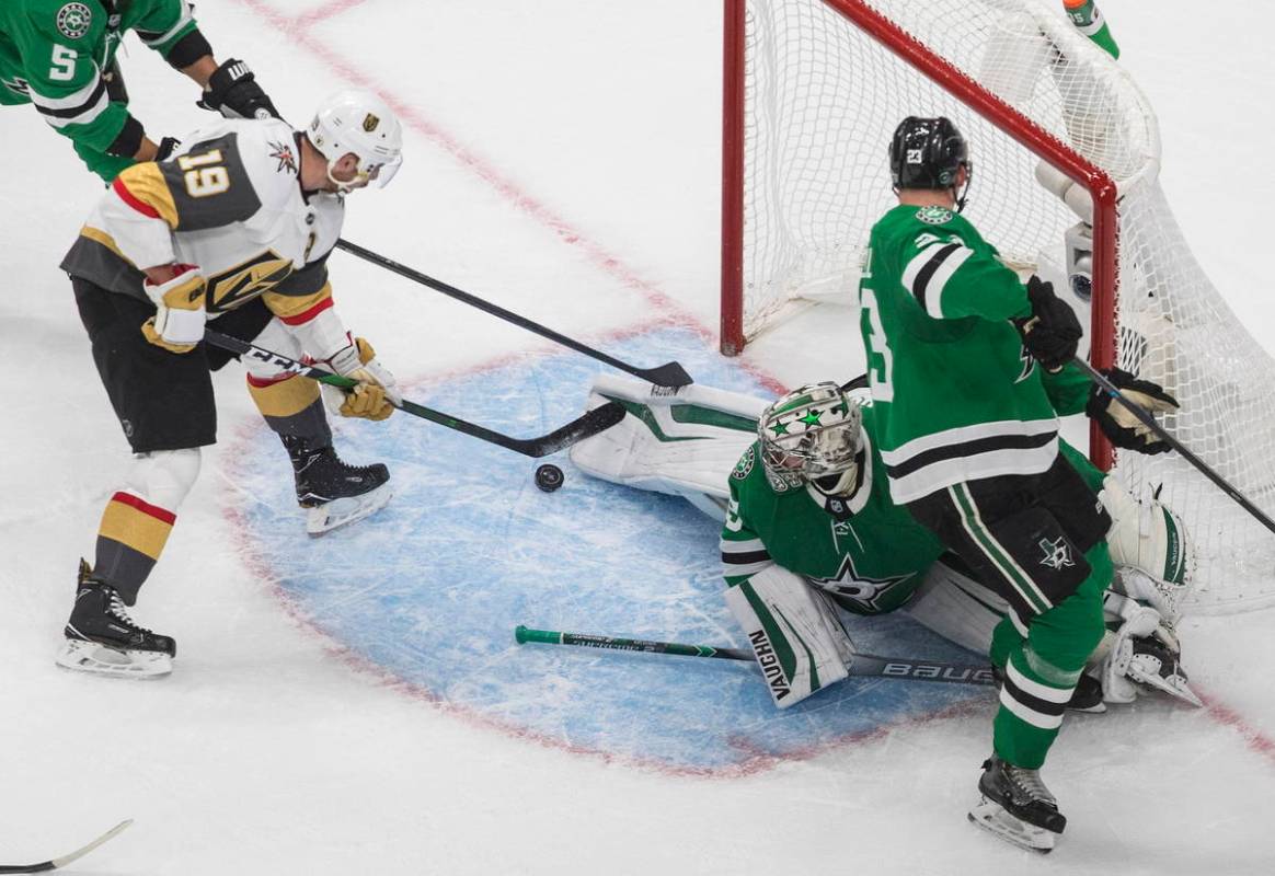 Dallas Stars goalie Anton Khudobin (35) makes a save on Vegas Golden Knights' Reilly Smith (19) ...