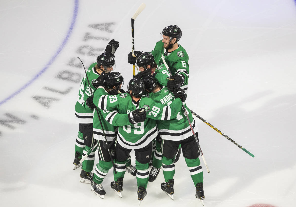 Dallas Stars celebrate an overtime win against the Vegas Golden Knights in Game 3 of the NHL ho ...