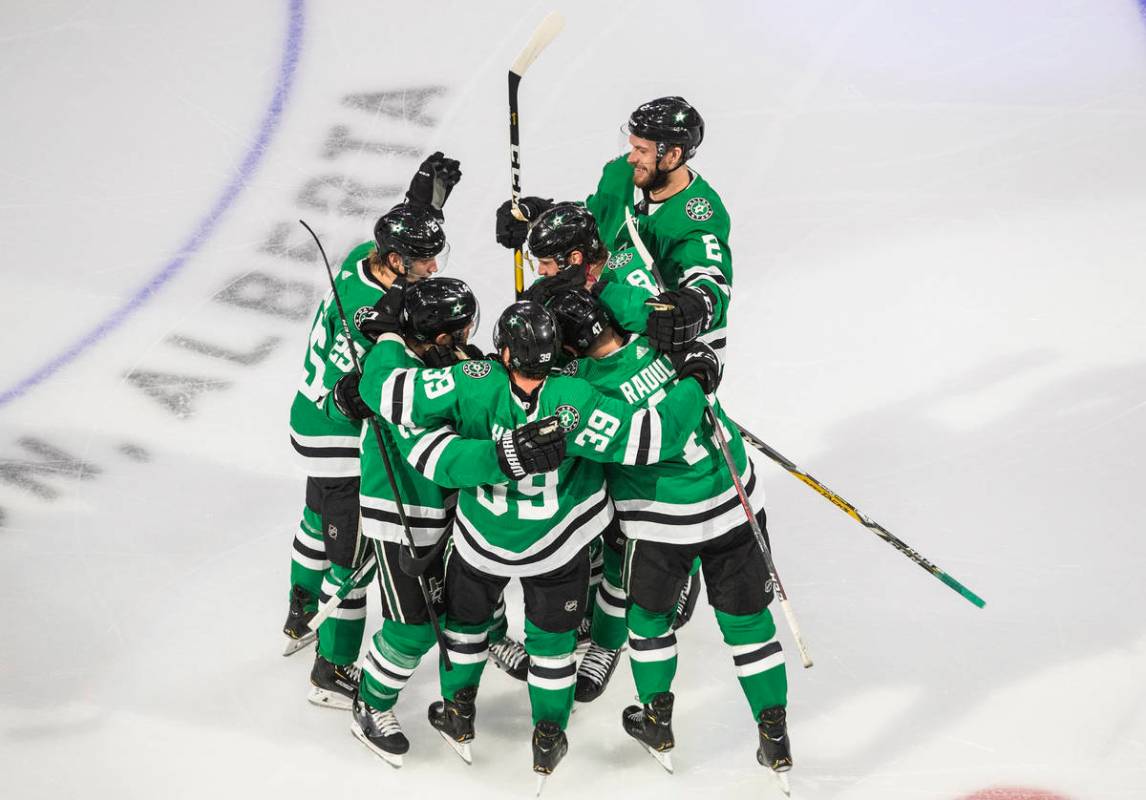Dallas Stars celebrate an overtime win against the Vegas Golden Knights in Game 3 of the NHL ho ...