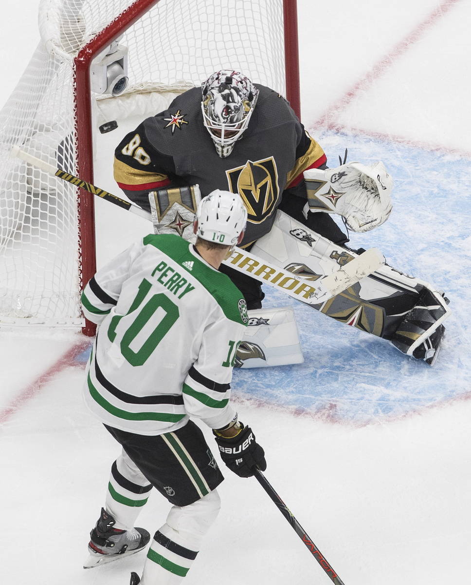 Dallas Stars' Corey Perry (10) is stopped by Vegas Golden Knights' goalie Robin Lehner (90) dur ...