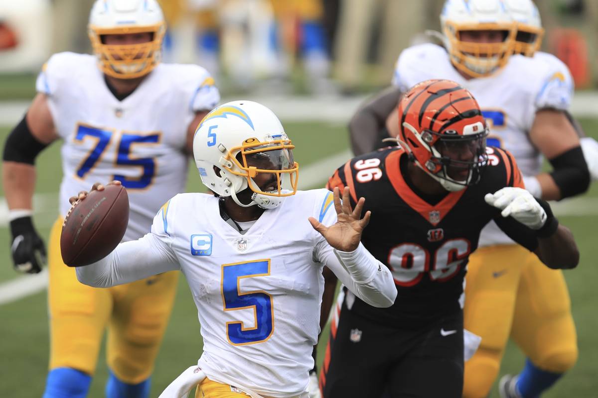 Los Angeles Chargers quarterback Tyrod Taylor (5) throws during the first half of an NFL footba ...