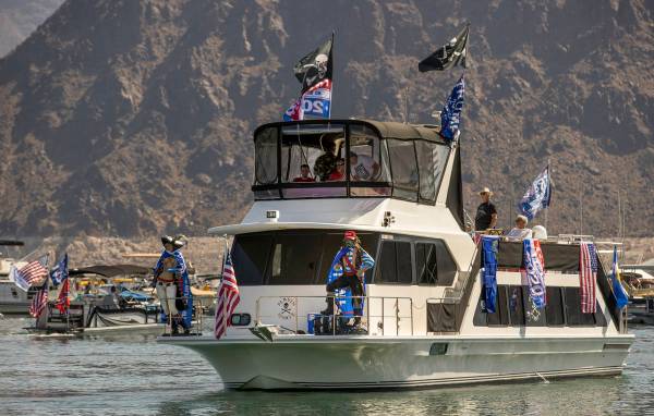 A decked out boat leaves the harbor for the President Donald Trump boat parade at the Lake Mead ...