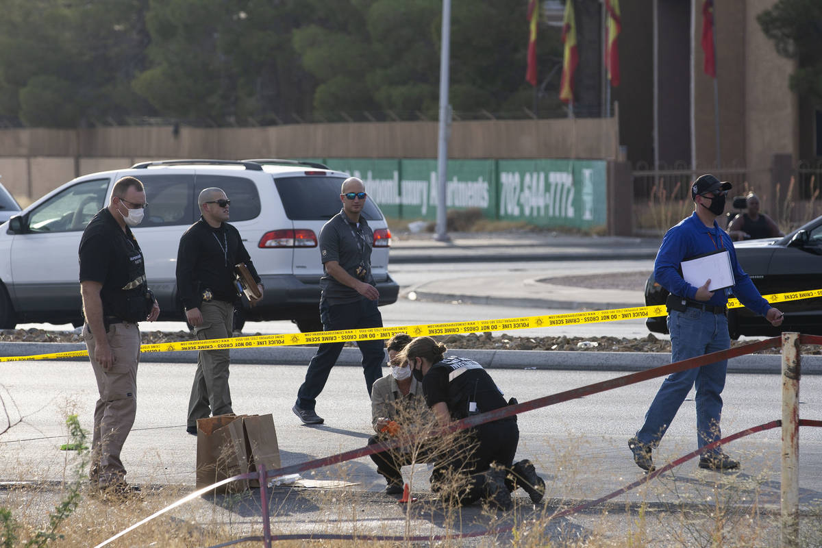 Las Vegas police collect evidence while investigating the homicide of a juvenile near the inter ...