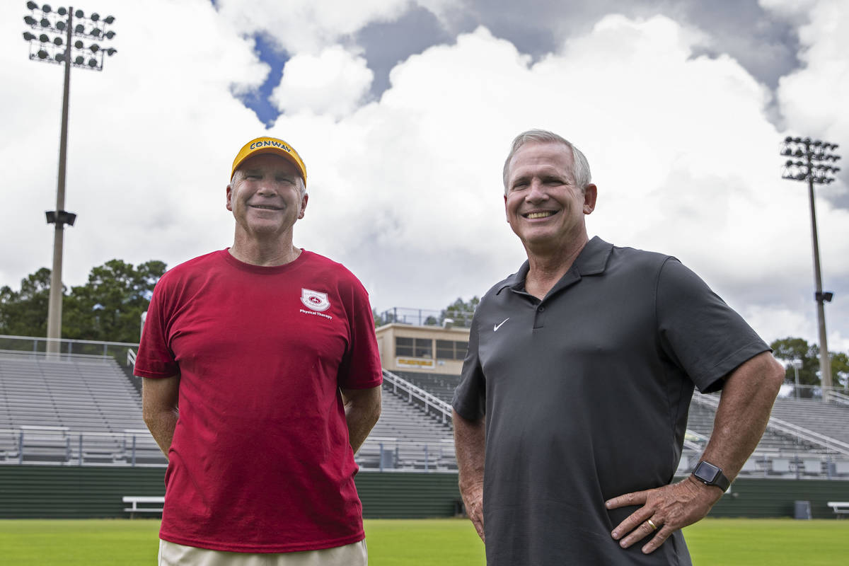 Tim Renfrow, right, father of Raiders wide receiver Hunter Renfrow, and Chuck Jordan, former hi ...