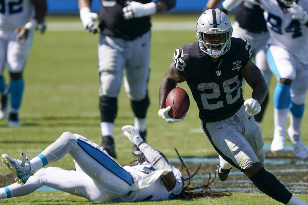 Las Vegas Raiders running back Josh Jacobs runs against the Carolina Panthers during the second ...