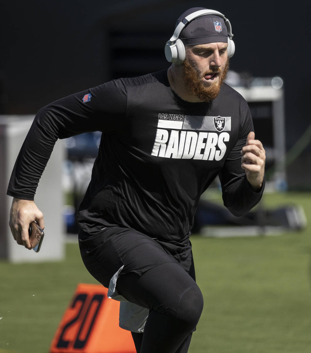 Las Vegas Raiders defensive end Maxx Crosby (98) warms up before the start of their NFL footbal ...