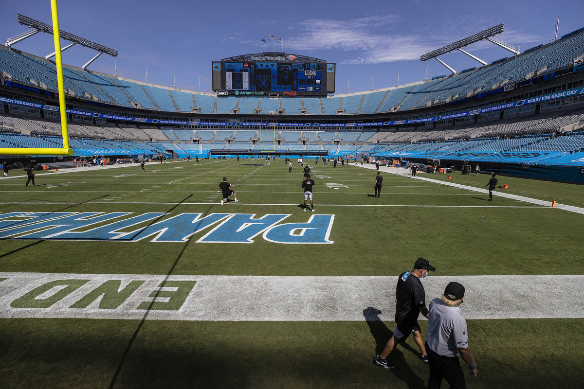 The Las Vegas Raiders warm up before the start of their NFL football game with the Carolina Pan ...