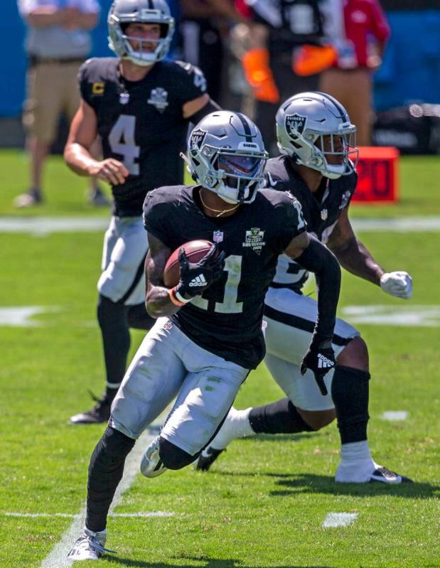 Las Vegas Raiders wide receiver Henry Ruggs III (11) runs with the football on a reverse from L ...