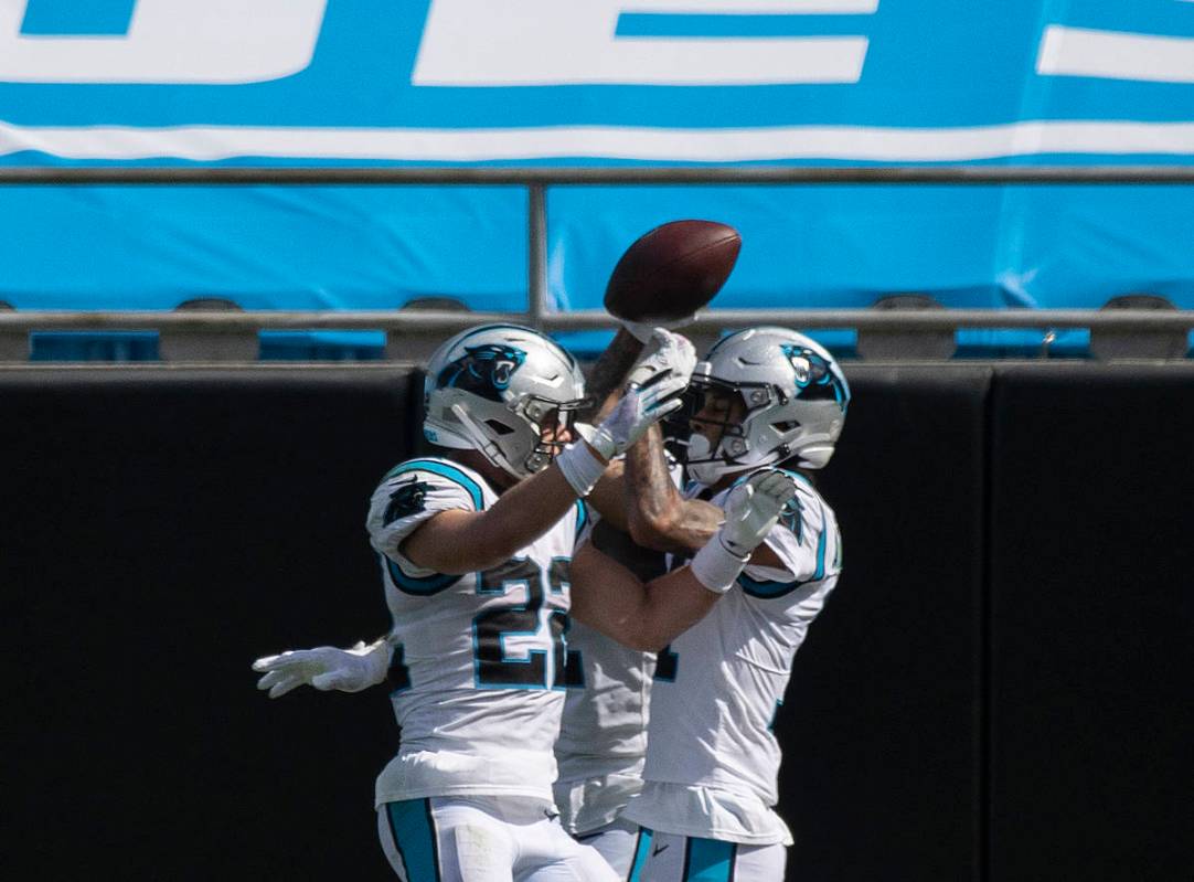Carolina Panthers running back Christian McCaffrey (22) celebrates a Panthers touchdown with te ...