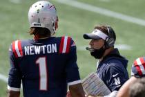 New England Patriots offensive coordinator Josh McDaniels, right, speaks to quarterback Cam New ...