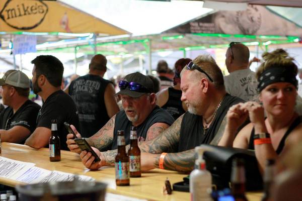 People congregate at One-Eyed Jack's Saloon during the 80th annual Sturgis Motorcycle Rally in ...