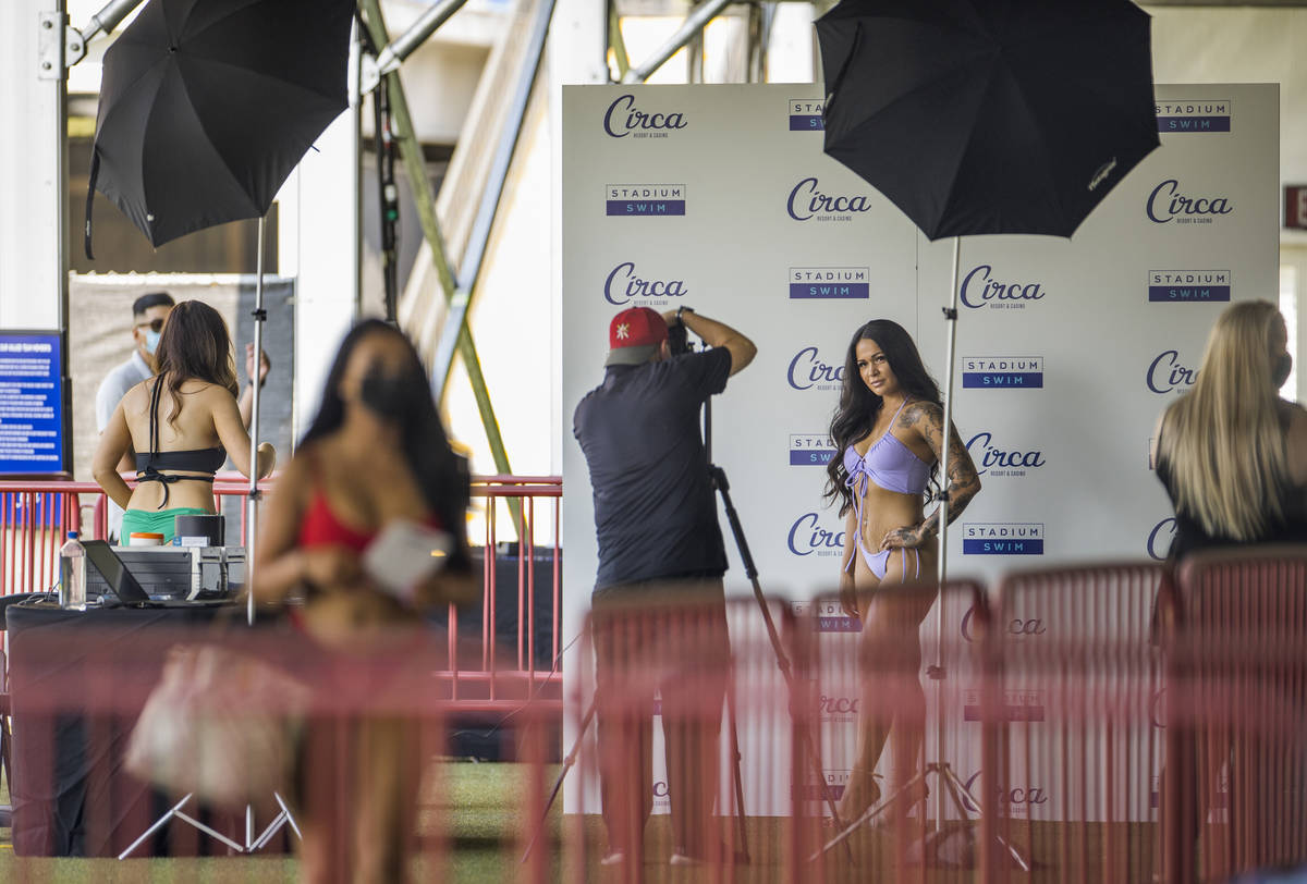Job applicants are photographed as Circa's Stadium Swim hosts auditions for more than 100 jobs ...