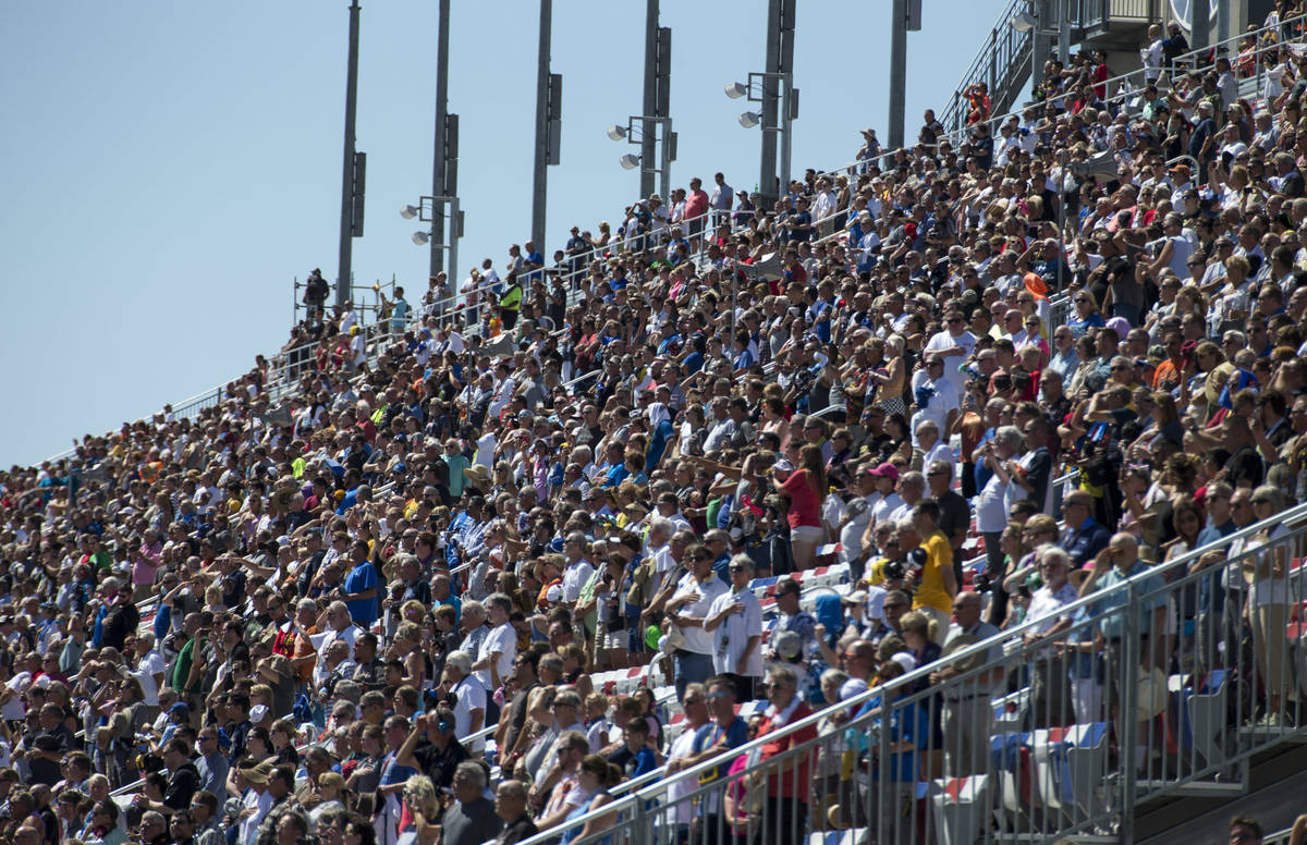 Race fans watch the South Point 400 NASCAR Cup Series auto race at the Las Vegas Motor Speedway ...