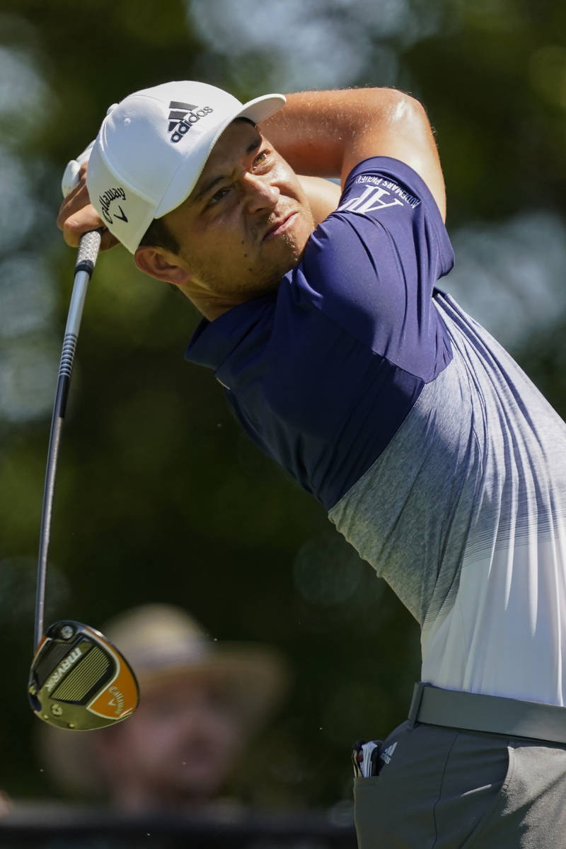Xander Schauffele hits his tee shot on the third hole during the final round of the Tour Champi ...