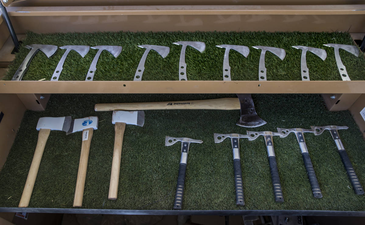 A variety of axes are ready for throwing at Adrenaline Mountain, which offers numerous extreme ...