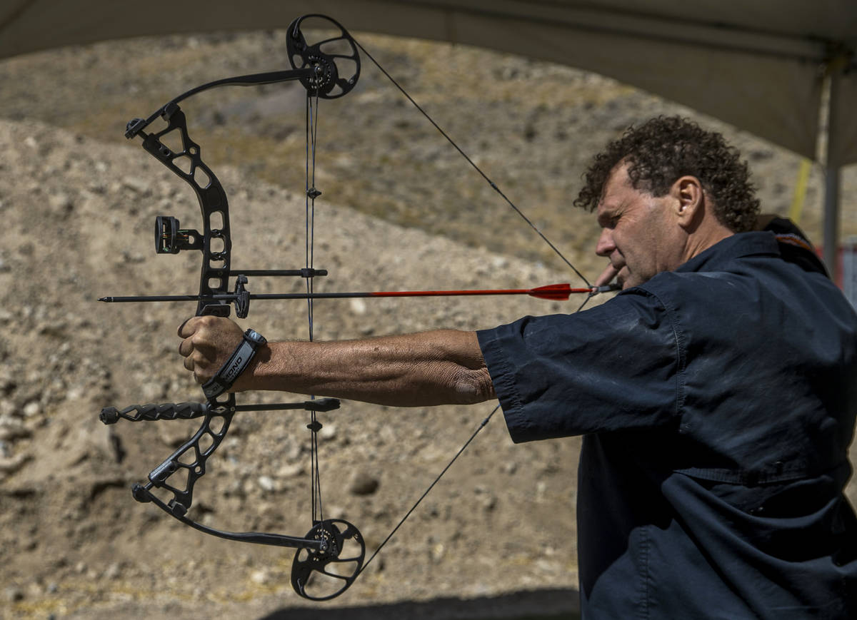 Adrenaline Mountain owner and CEO Eric Brashear eyes a target while using a compound bow, Thurs ...