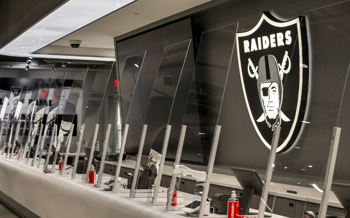 Th cashier areas are COVID-19 safe with plexiglass within The Raider Image official team store ...