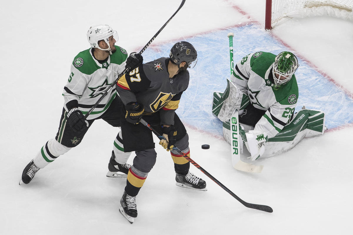 Dallas Stars goalie Jake Oettinger (29) makes a save on Vegas Golden Knights' Max Pacioretty (6 ...