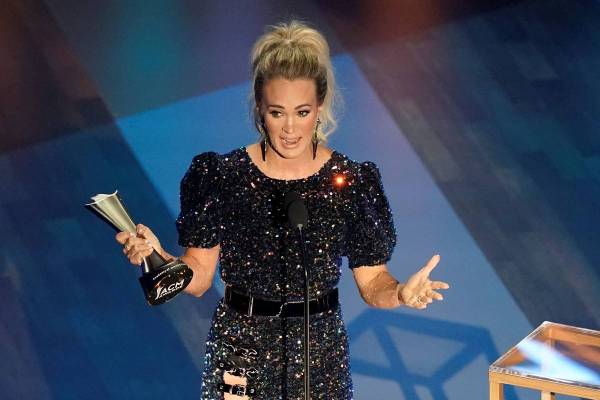 Carrie Underwood accepts the entertainer of the year award during the 55th annual Academy of Co ...
