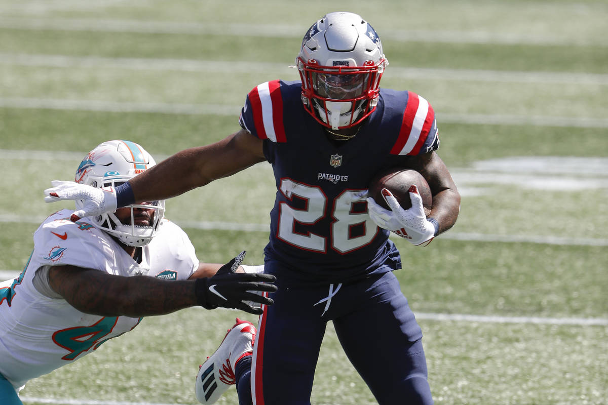 New England Patriots running back James White runs the ball against the Miami Dolphins during a ...