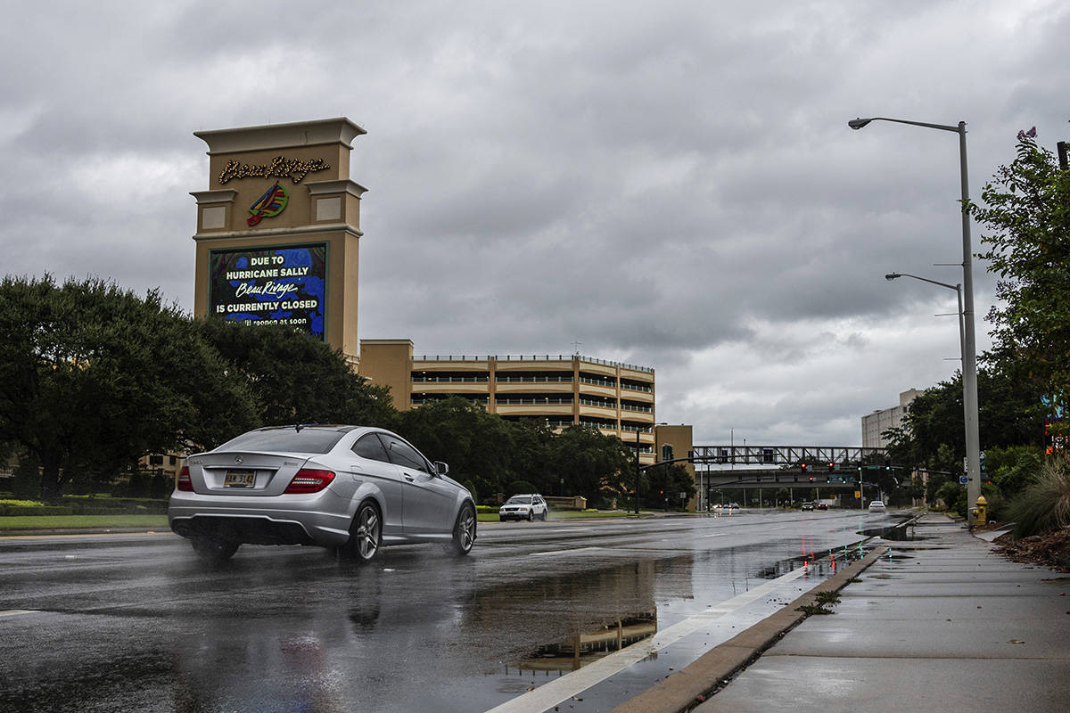 Sparce traffic moves across U.S. Highway 90 outside the Beau Rivage Casino in Biloxi, Miss., as ...