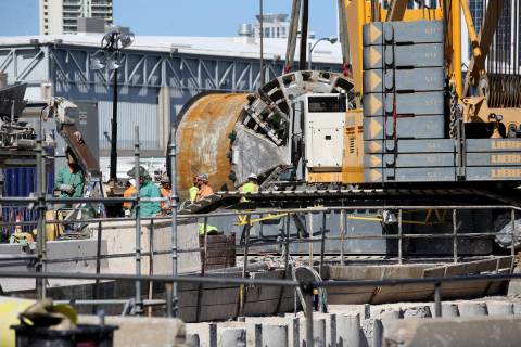 The Boring Co. workers prepare to lower the drill assembly to begin work on the second tunnel i ...
