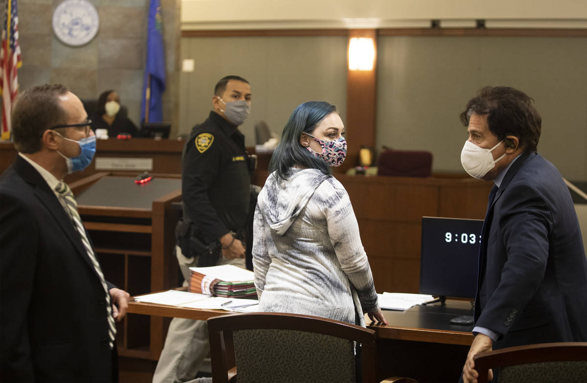 Alisha Burns makes her way to the stand next to her lawyer Tony Abbatangelo, left, and law cler ...