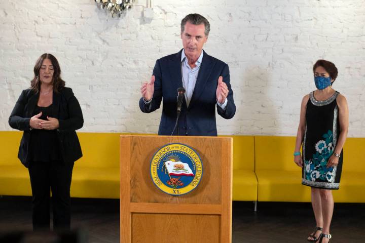 California Gov. Gavin Newsom speaks at a press conference at Solomon's Delicatessen in Sacramen ...